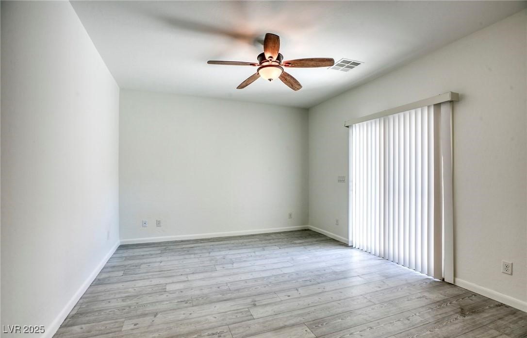 7600 Finishing Touch Court Las Vegas, NV 89149 - Photo 25 of 32 Spare room with a ceiling fan and light wood-style flooring