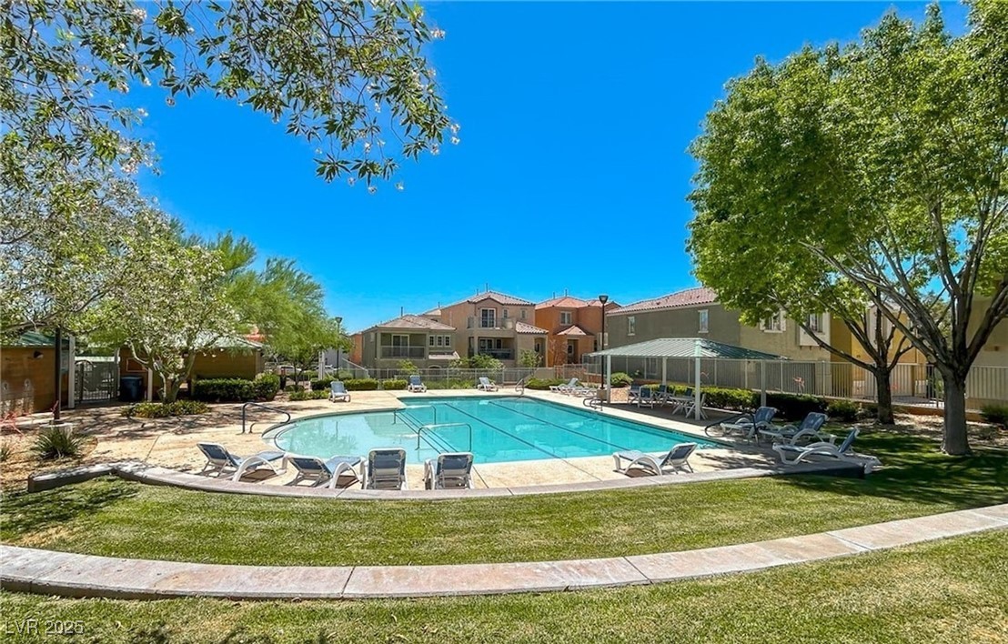 7600 Finishing Touch Court Las Vegas, NV 89149 - Photo 32 of 32 Community pool featuring a patio and a residential view