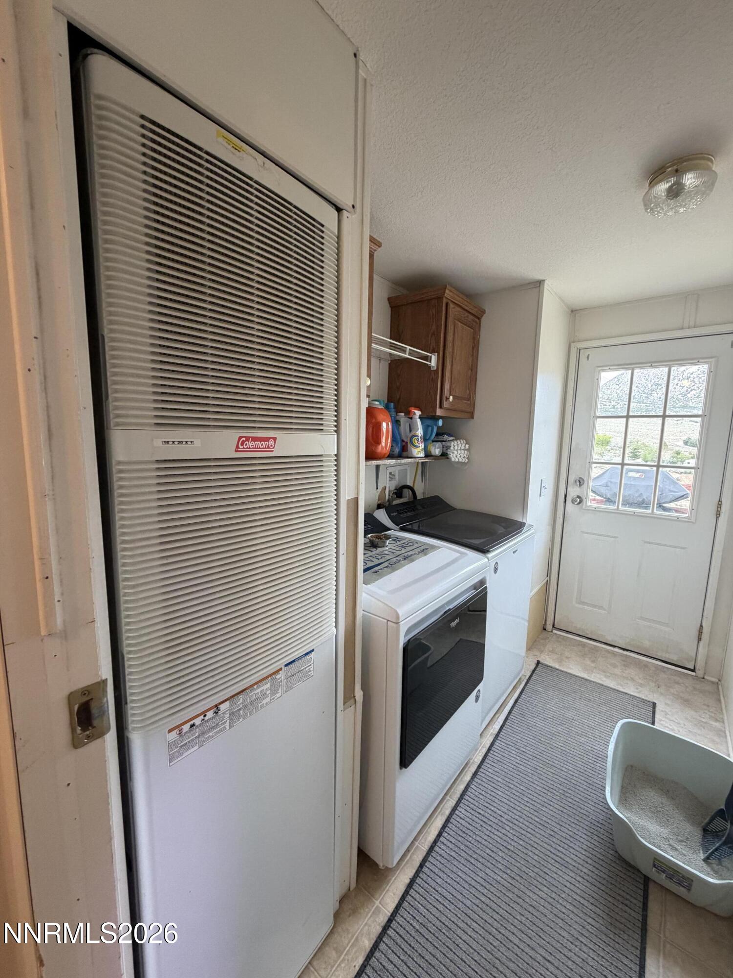3920 Sandstone Drive Topaz Ranch Estates, NV 89444 - Photo 18 of 20 a kitchen with a refrigerator and a window