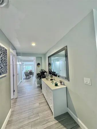 a view of a livingroom with furniture and flat screen tv
