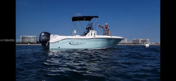 a view of a bench in the back yard of a house