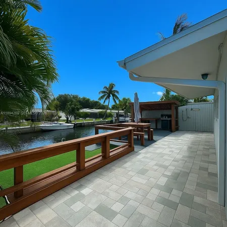 a view of swimming pool with outdoor seating and plants