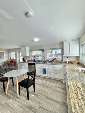 a kitchen with granite countertop cabinets and counter space