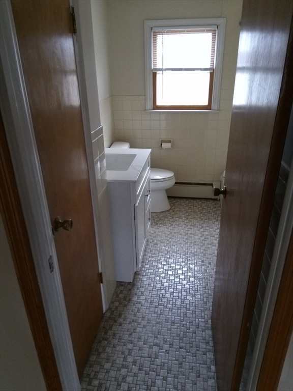 121 King Philip Road Worcester, MA 01606 - Photo 12 of 31 a bathroom with sink toilet and window