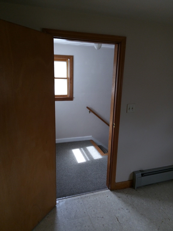 121 King Philip Road Worcester, MA 01606 - Photo 17 of 31 a view of empty room with wooden floor and fan