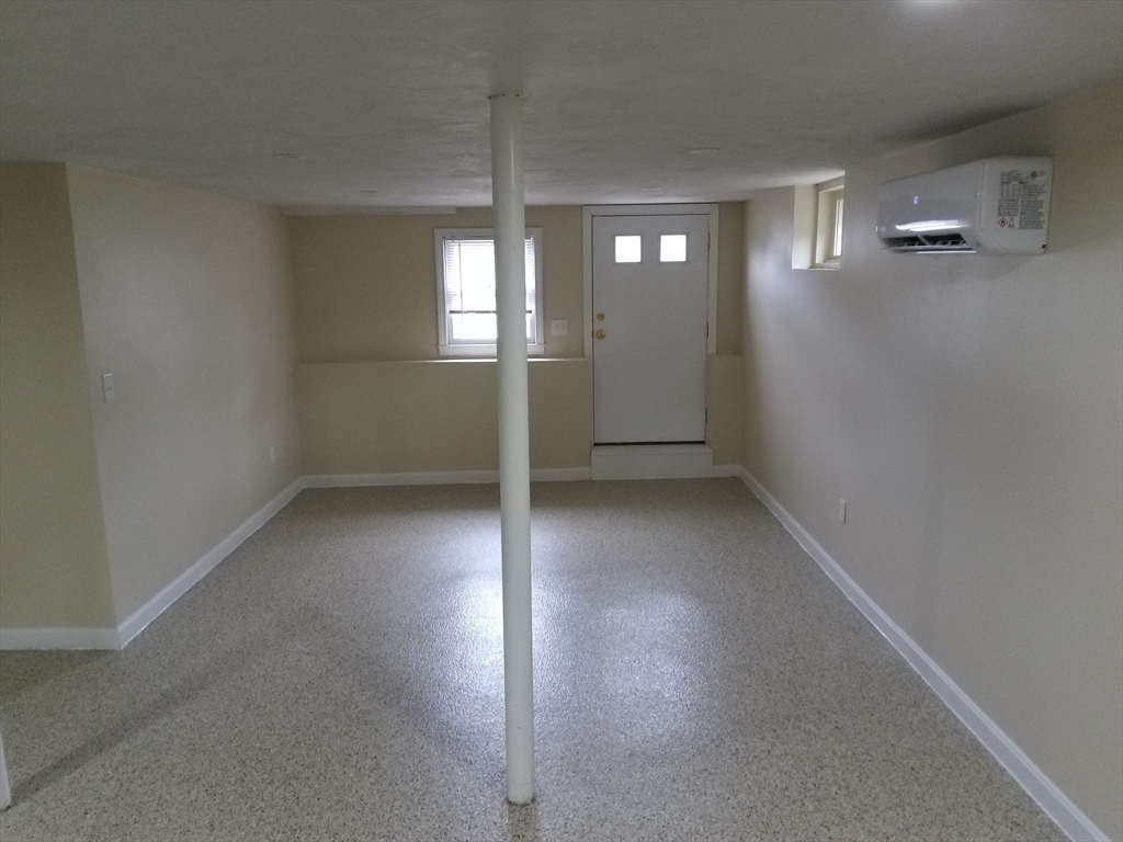 121 King Philip Road Worcester, MA 01606 - Photo 27 of 31 an empty room with windows