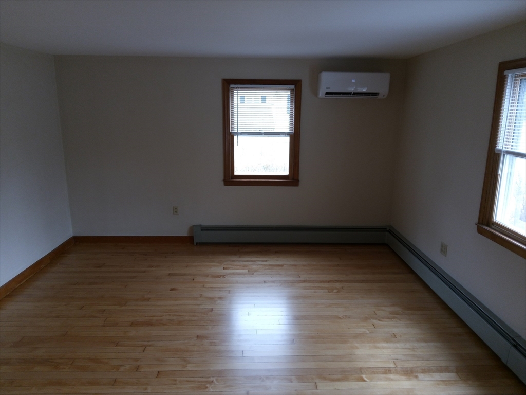 121 King Philip Road Worcester, MA 01606 - Photo 8 of 31 a view of a room with wooden floor and window