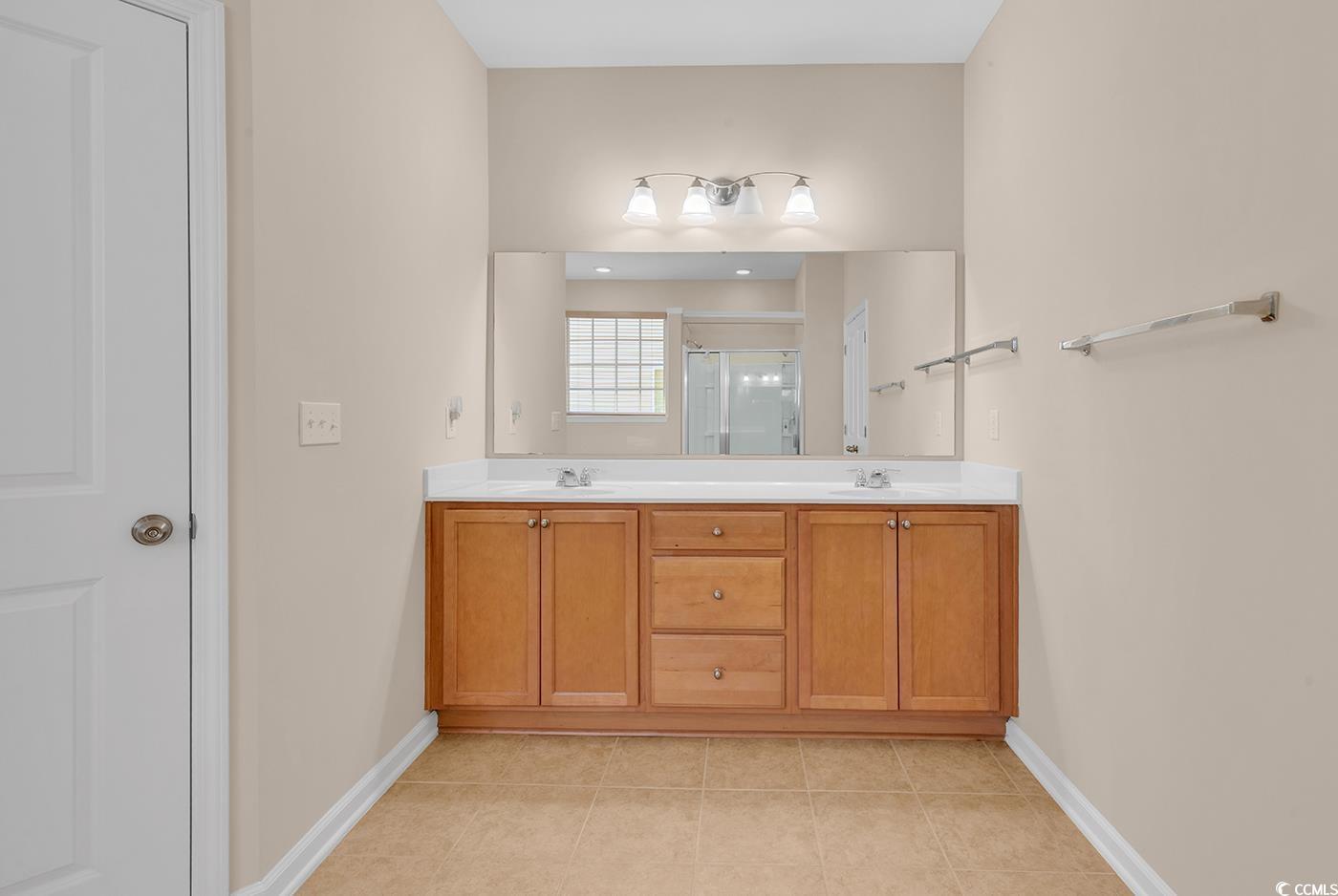 1612 Fairforest Court Conway, SC 29526 - Photo 24 of 40 Full bath featuring double vanity, a shower stall, and light tile patterned floors