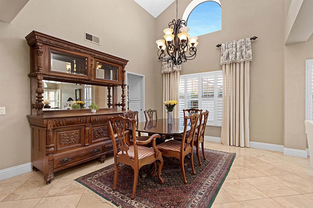 2046 Balboa Circle Vista, CA 92081 - Photo 15 of 37 a dining room with furniture a chandelier and window