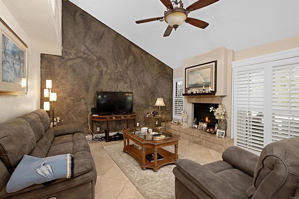 2046 Balboa Circle Vista, CA 92081 - Photo 16 of 37 a living room with furniture and a fireplace