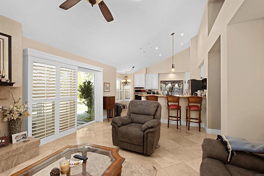 2046 Balboa Circle Vista, CA 92081 - Photo 17 of 37 a living room with furniture kitchen view and a large window