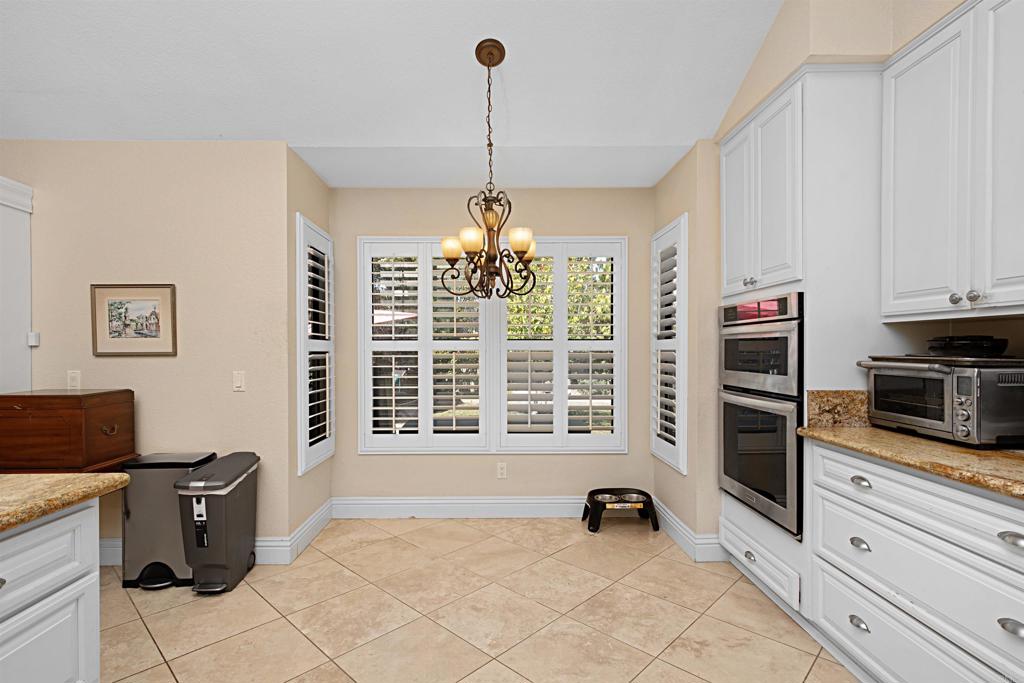 2046 Balboa Circle Vista, CA 92081 - Photo 19 of 37 a workspace with furniture and window