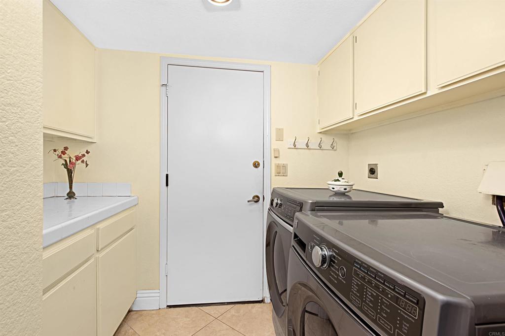 2046 Balboa Circle Vista, CA 92081 - Photo 37 of 37 a utility room with sink dryer and washer