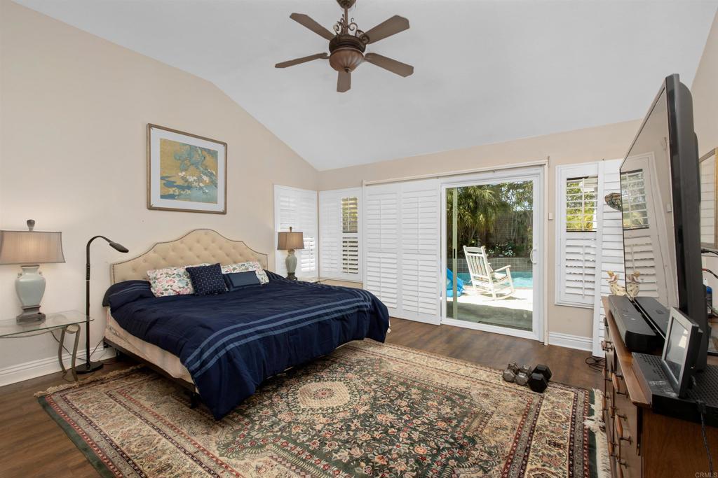 2046 Balboa Circle Vista, CA 92081 - Photo 10 of 37 a spacious bedroom with a large bed and a window