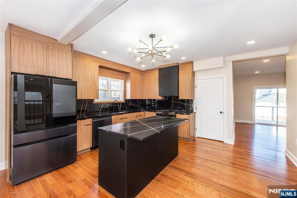 50 Grand Avenue Ridgefield Park, NJ 07660 - Photo 15 of 36 a kitchen with stainless steel appliances granite countertop a sink stove and refrigerator