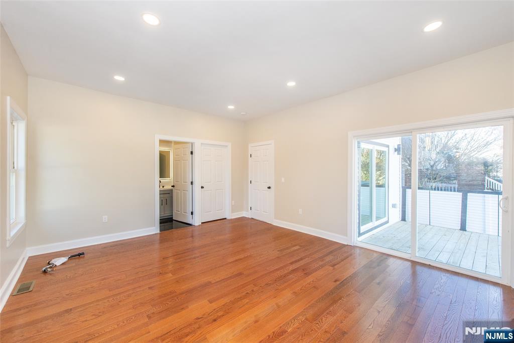 50 Grand Avenue Ridgefield Park, NJ 07660 - Photo 18 of 36 an empty room with wooden floor and windows