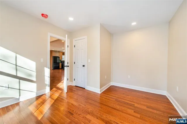 a spacious bathroom with a granite countertop sink toilet and shower