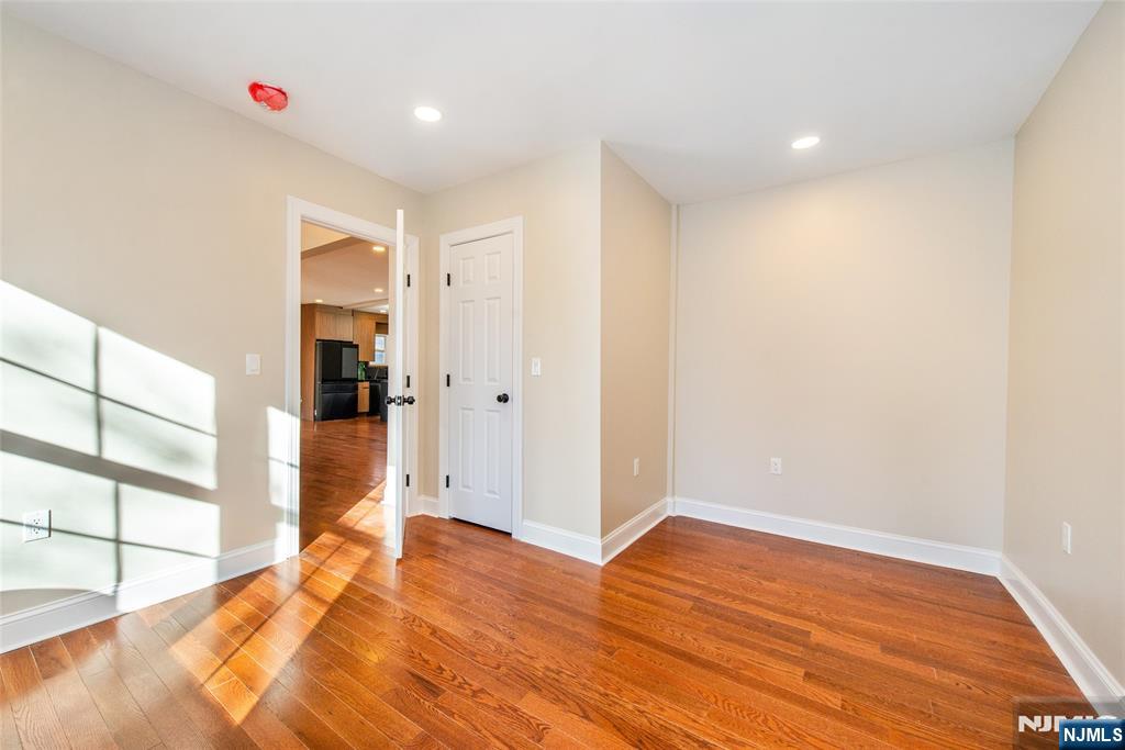 50 Grand Avenue Ridgefield Park, NJ 07660 - Photo 21 of 36 a view of empty room with wooden floor and entryway