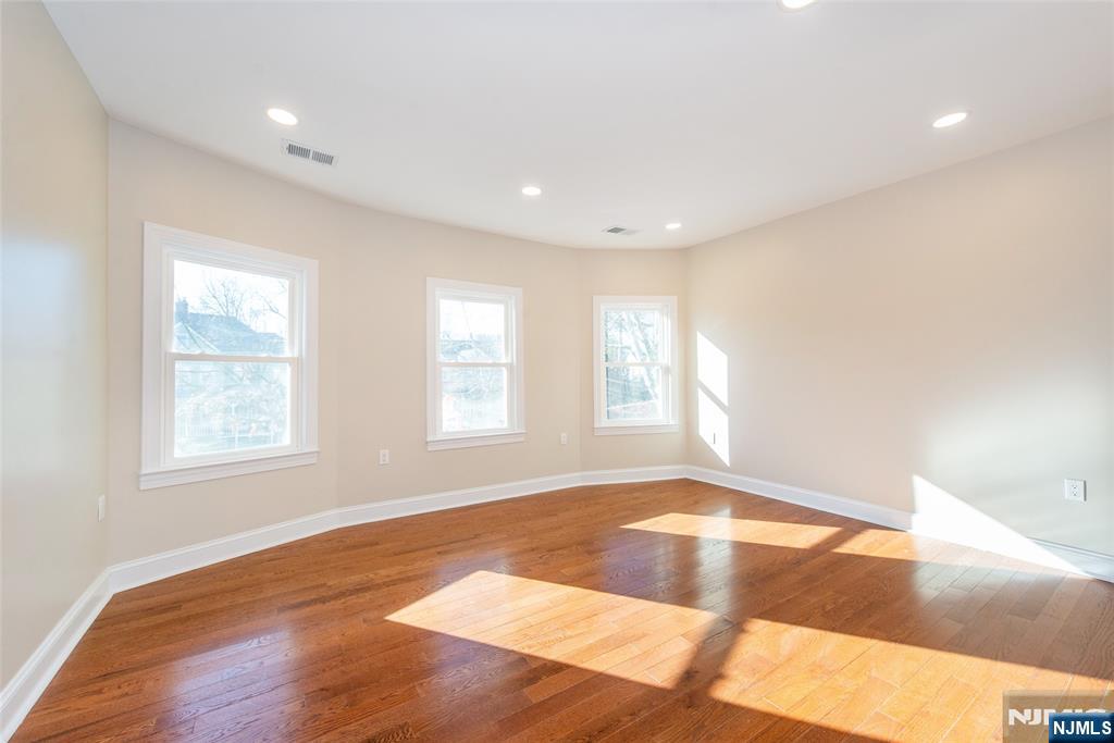 50 Grand Avenue Ridgefield Park, NJ 07660 - Photo 23 of 36 a view of an empty room with wooden floor and a window