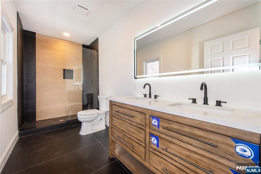 50 Grand Avenue Ridgefield Park, NJ 07660 - Photo 24 of 36 a bathroom with a sink and a mirror