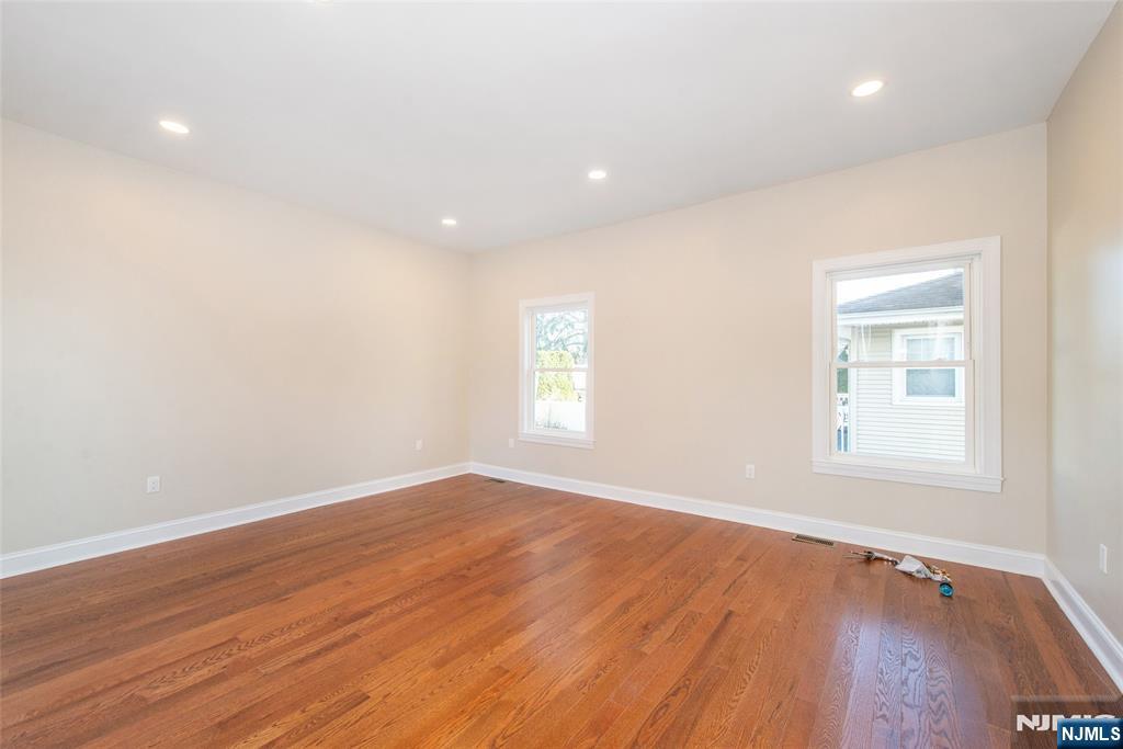 50 Grand Avenue Ridgefield Park, NJ 07660 - Photo 26 of 36 an empty room with wooden floor and windows