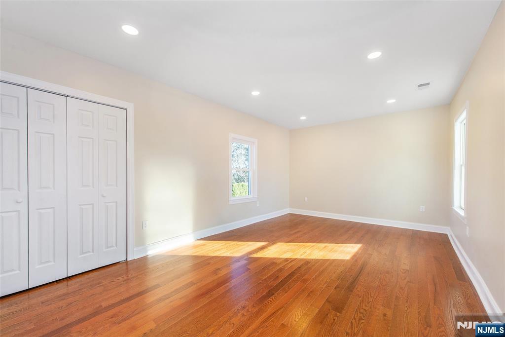 50 Grand Avenue Ridgefield Park, NJ 07660 - Photo 29 of 36 an empty room with wooden floor and windows