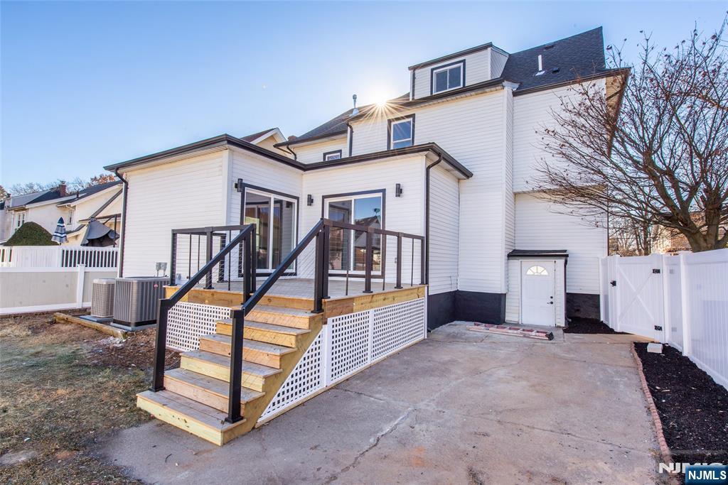 50 Grand Avenue Ridgefield Park, NJ 07660 - Photo 33 of 36 a view of house with a large windows and a ceiling fan
