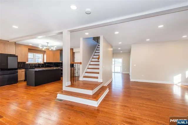 a view of a kitchen with a sink and a kitchen counter top