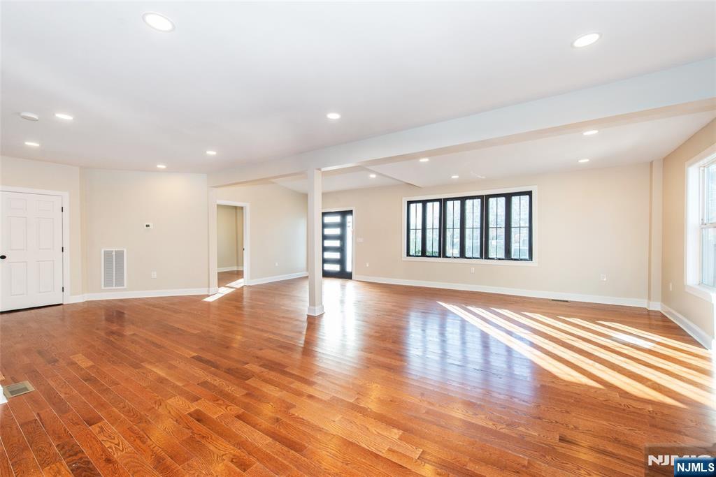 50 Grand Avenue Ridgefield Park, NJ 07660 - Photo 6 of 36 a view of an empty room with wooden floor and a window