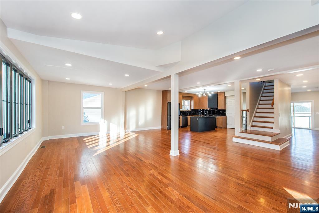 50 Grand Avenue Ridgefield Park, NJ 07660 - Photo 7 of 36 a view of an empty room with wooden floor and a kitchen