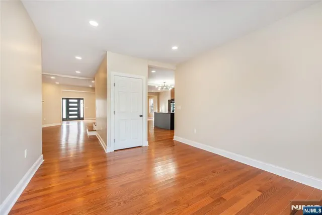 a kitchen with kitchen island granite countertop a sink appliances cabinets and a counter top space