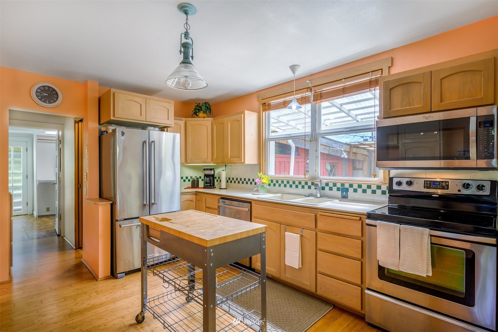 2313 Rucker Avenue Everett, WA 98201 - Photo 15 of 35 a kitchen with stainless steel appliances granite countertop a stove a refrigerator and a microwave