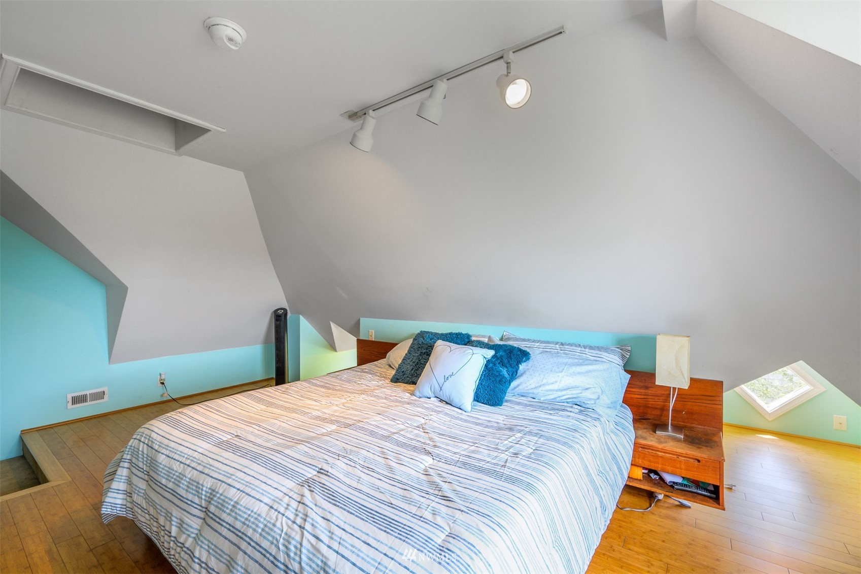 2313 Rucker Avenue Everett, WA 98201 - Photo 20 of 35 a bedroom with a bed and wooden floor