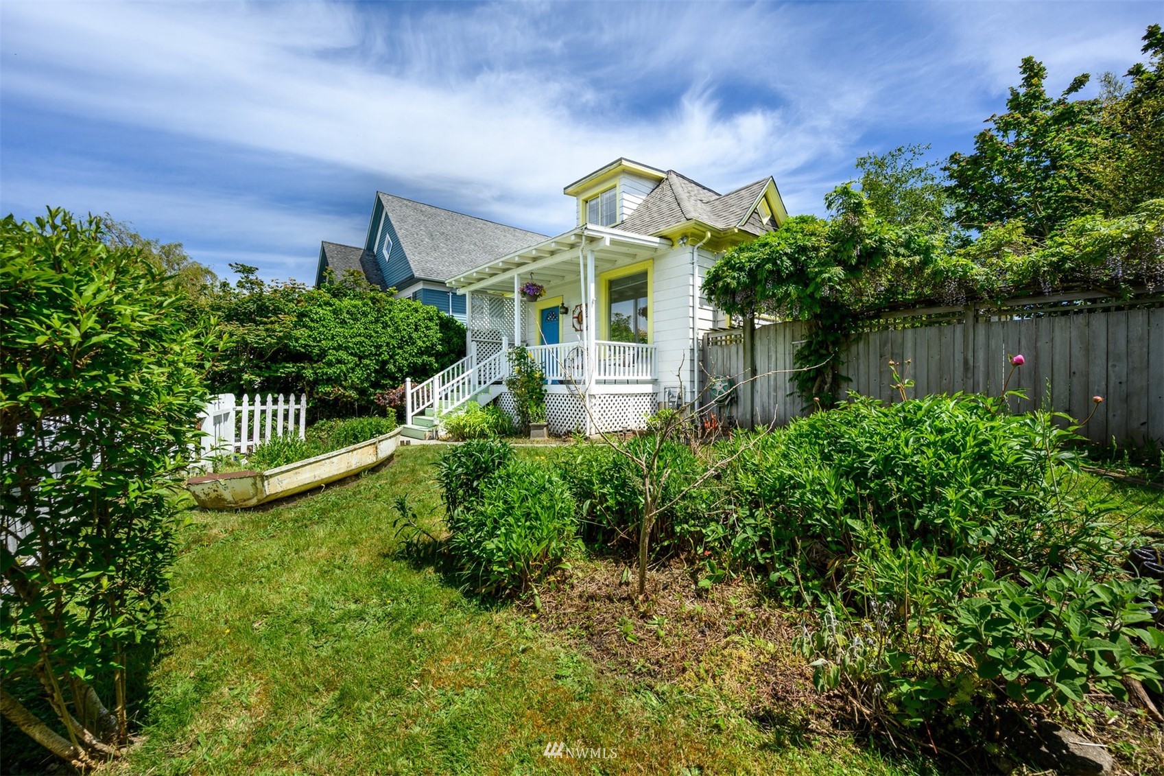 2313 Rucker Avenue Everett, WA 98201 - Photo 32 of 35 a view of a house with a small yard plants and large tree