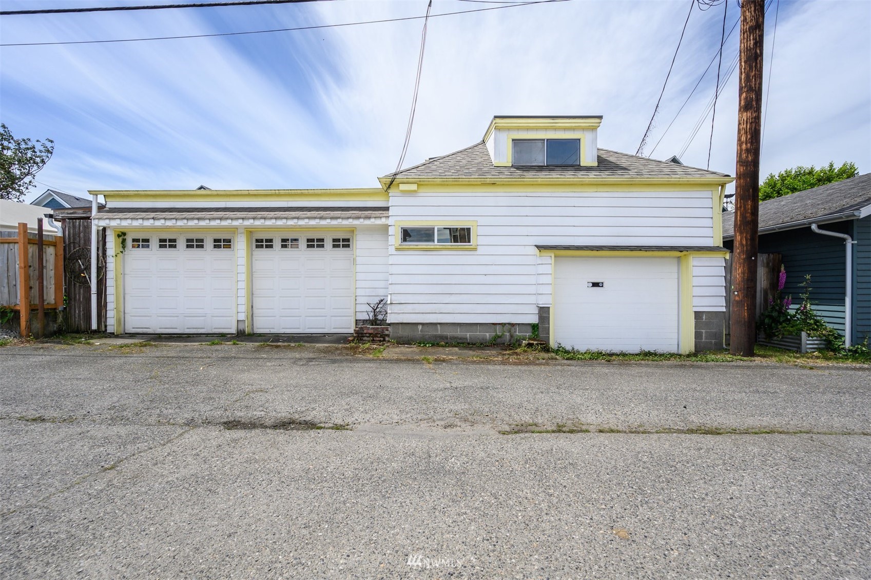 2313 Rucker Avenue Everett, WA 98201 - Photo 34 of 35 a front view of a house with a yard and garage