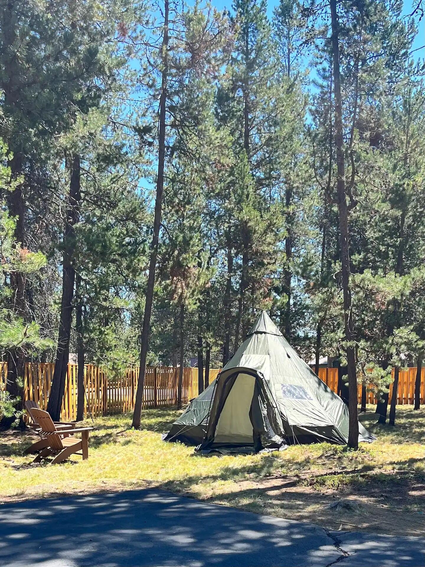 56065 Snow Goose Road Bend, OR 97707 - Photo 58 of 65 Fully fenced, gated front yard for your outdoor campground/playground!8-10 person Tee Pee tent! Wood burning fire pit too!