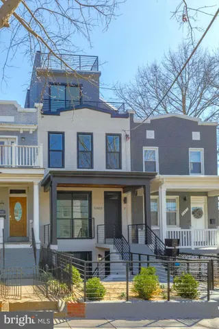 a view of a chairs and table in the balcony