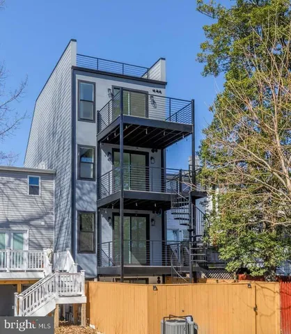 a view of a swimming pool with an outdoor seating