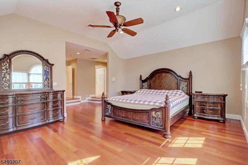 24 Pine Brook Road Montville, NJ 07082 - Photo 12 of 27 a bedroom with a bed and wooden floor
