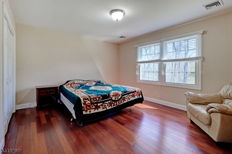 24 Pine Brook Road Montville, NJ 07082 - Photo 17 of 27 a bedroom with wooden floor and window