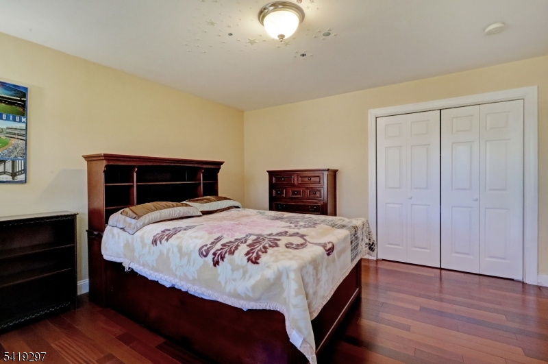 24 Pine Brook Road Montville, NJ 07082 - Photo 18 of 27 a bedroom with a bed and a dresser