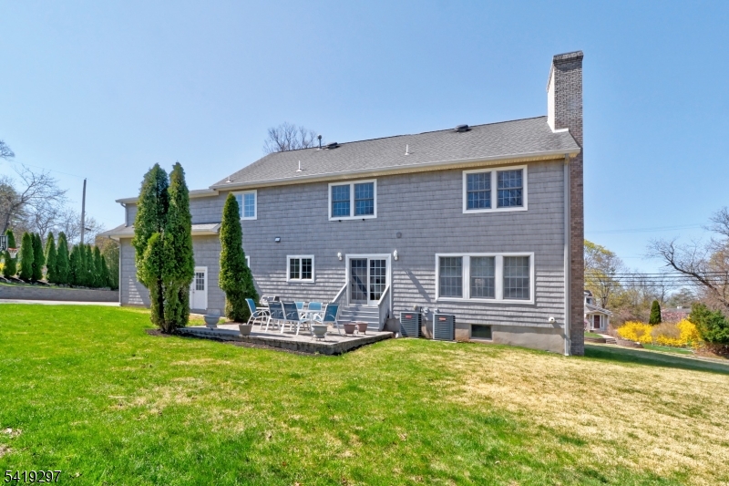 24 Pine Brook Road Montville, NJ 07082 - Photo 24 of 27 a backyard of a house with yard table and chairs