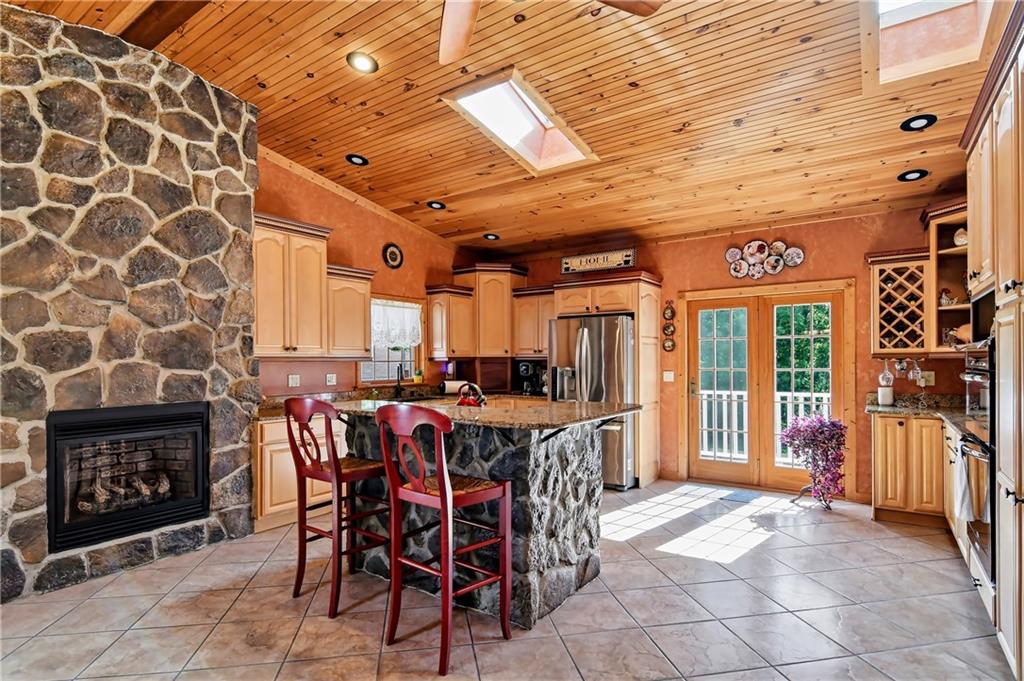 2516 Clayton Road Beaver Falls, PA 15010 - Photo 2 of 24 Large Kitchen with Stone fireplace and stone kitchen island