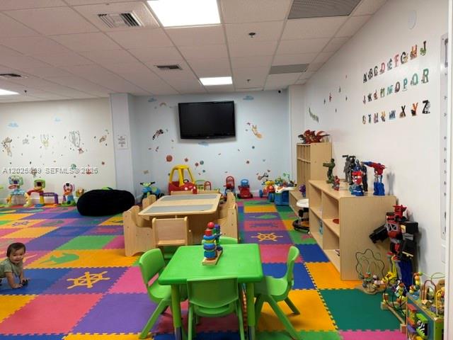 540 Brickell Key Drive, Unit 1024 Miami, FL 33131 - Photo 11 of 28 a play room with toys and a flat screen tv