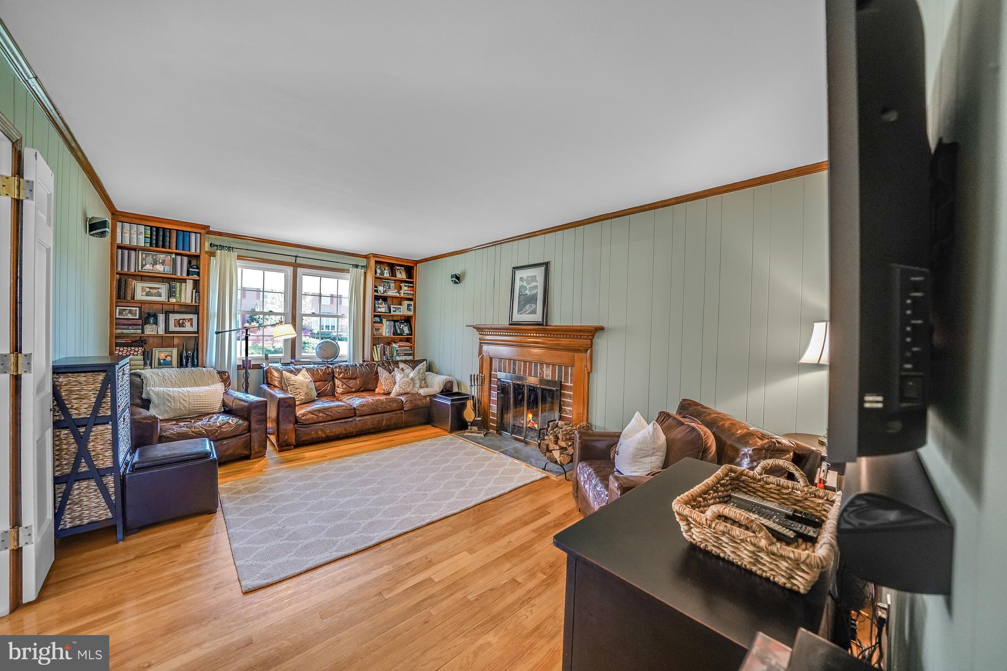 703 Burnley Road Wilmington, DE 19803 - Photo 8 of 27 Family room with fireplace & built ins