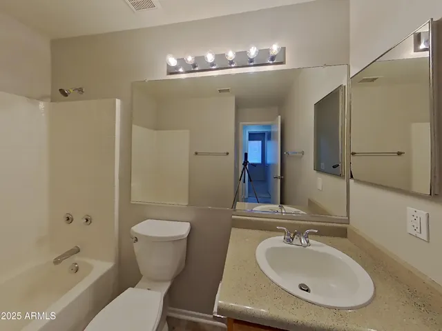 a bathroom with a bathtub and a toilet