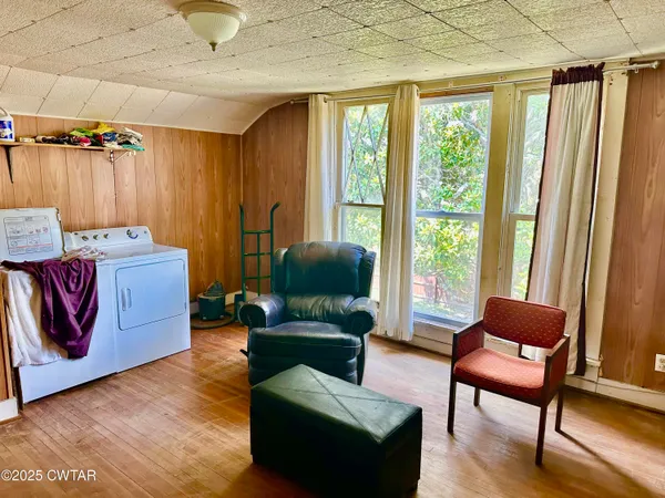 a bedroom with a bed and a tv on table