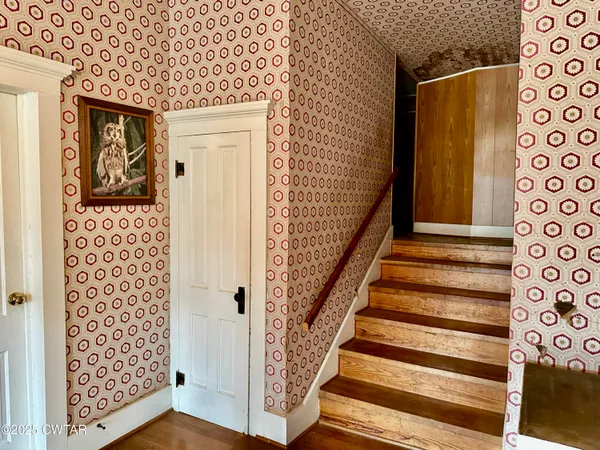 a view of entryway with wooden floor