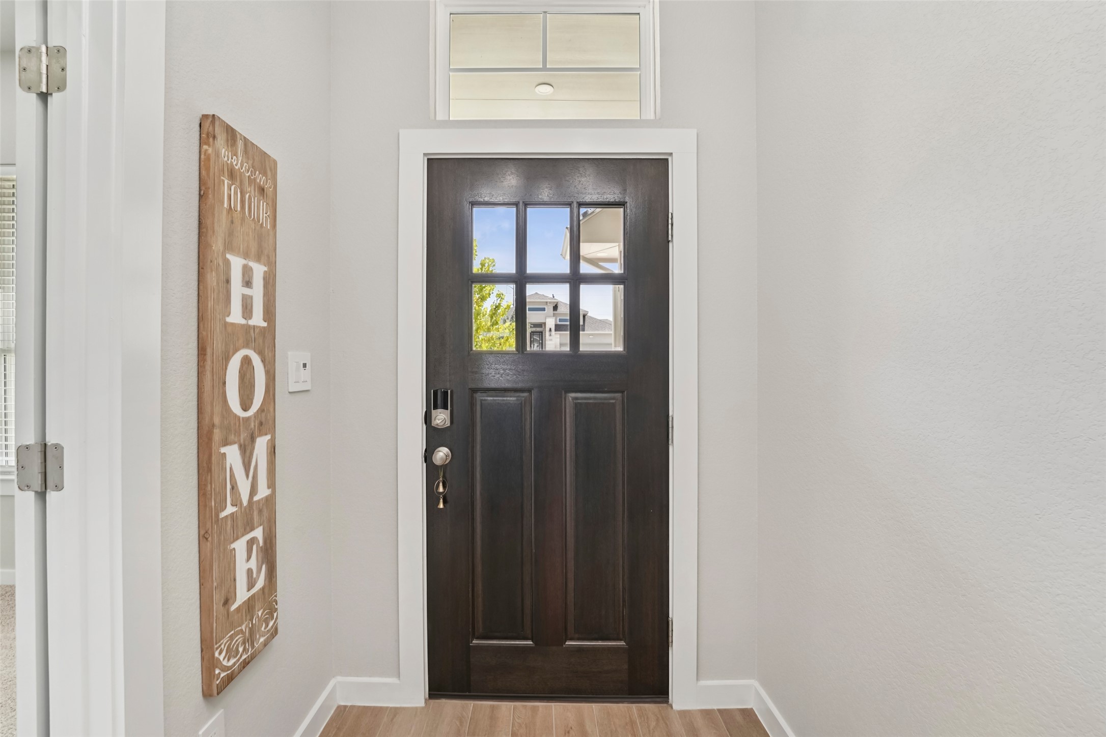 1108 Sweetspire Street Leander, TX 78641 - Photo 17 of 39 Entrance foyer with baseboards and wood finished floors