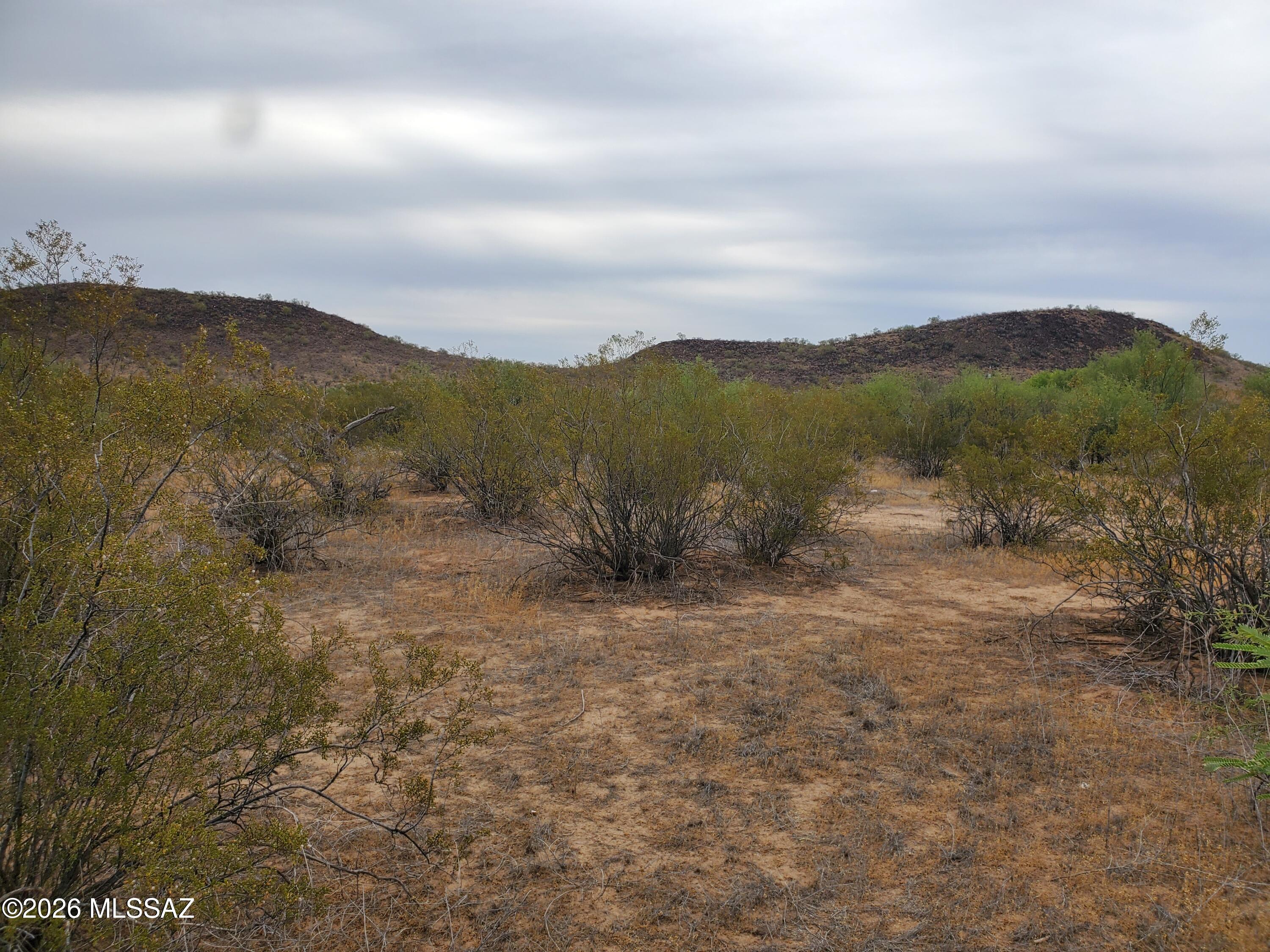 7925 South Worden Road Tucson, AZ 85735 - Photo 9 of 20 a view of a lake with mountains in the background
